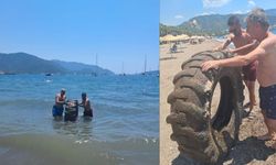 Marmaris Halk Plajı’nda denizden traktör lastiği çıkarıldı
