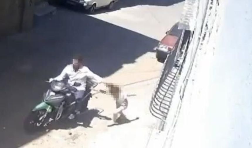 Küçük kızını darbedip motosikletle sürükledi