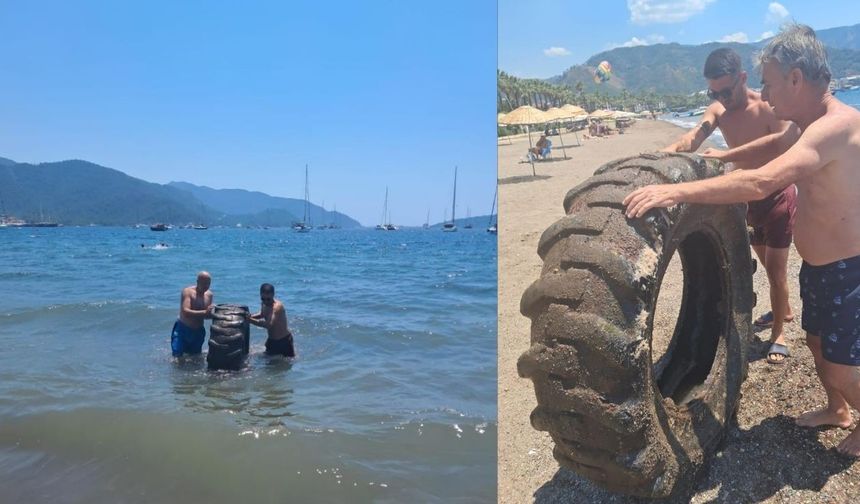 Marmaris Halk Plajı’nda denizden traktör lastiği çıkarıldı
